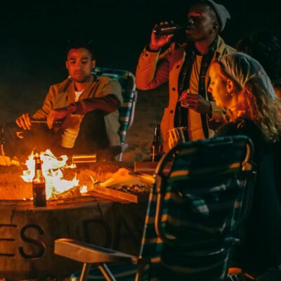 Group of Friends Eating in Front of Fire Pit