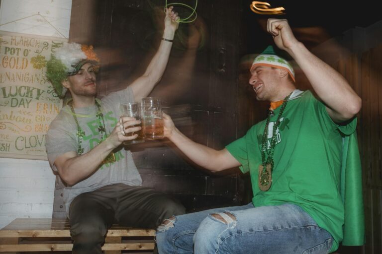 Happy friends celebrating national holiday drinking beer